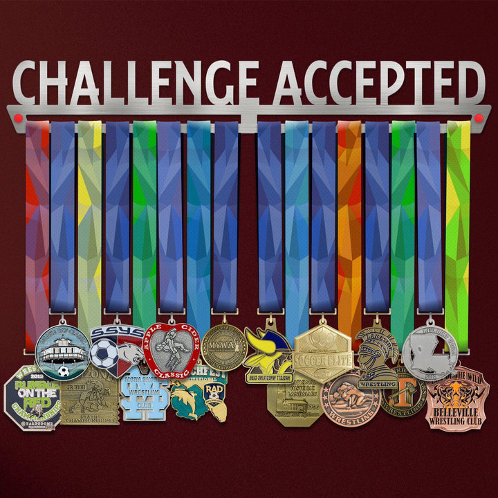 Challenge Accepted Medal Hanger Display holding colorful sports medals with rainbow ribbons, ideal for organizing and showcasing achievements.