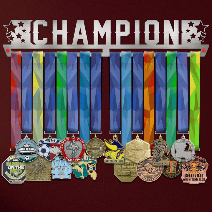 Champion Medal Hanger Display V1 showcasing 12 colorful medals on a stainless steel rack with 'CHAMPION' cutout design and star accents.